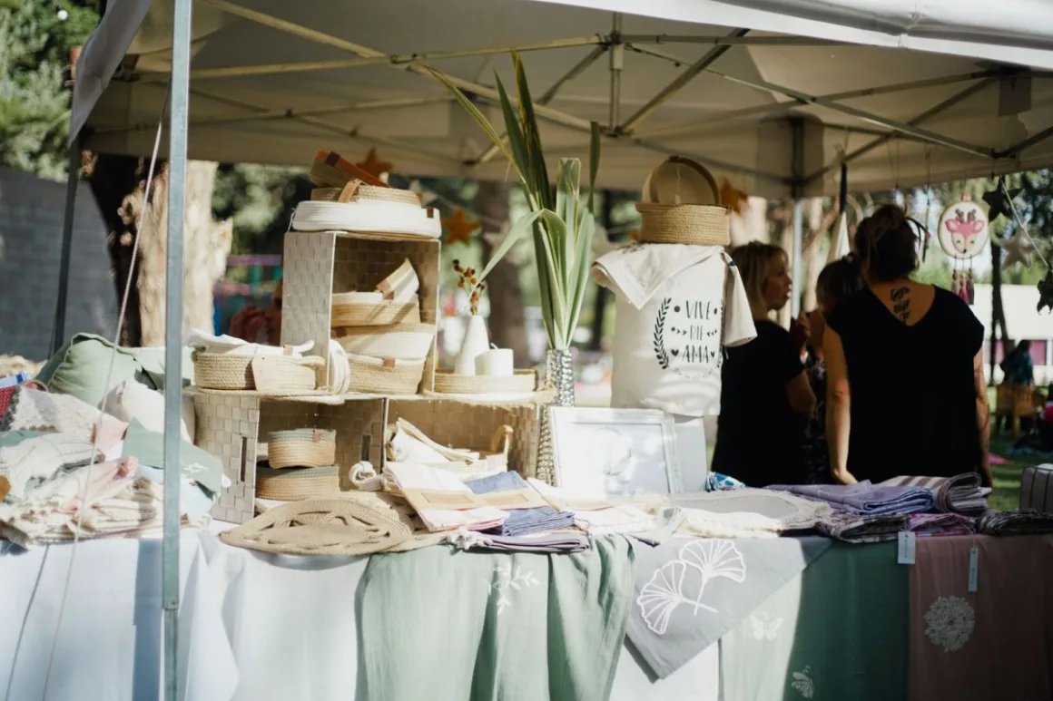 Craft Markets: 11 Proven Tips for a Profitable First Stall An outdoor stall of handcrafted textiles and baskets of the kind found at craft markets