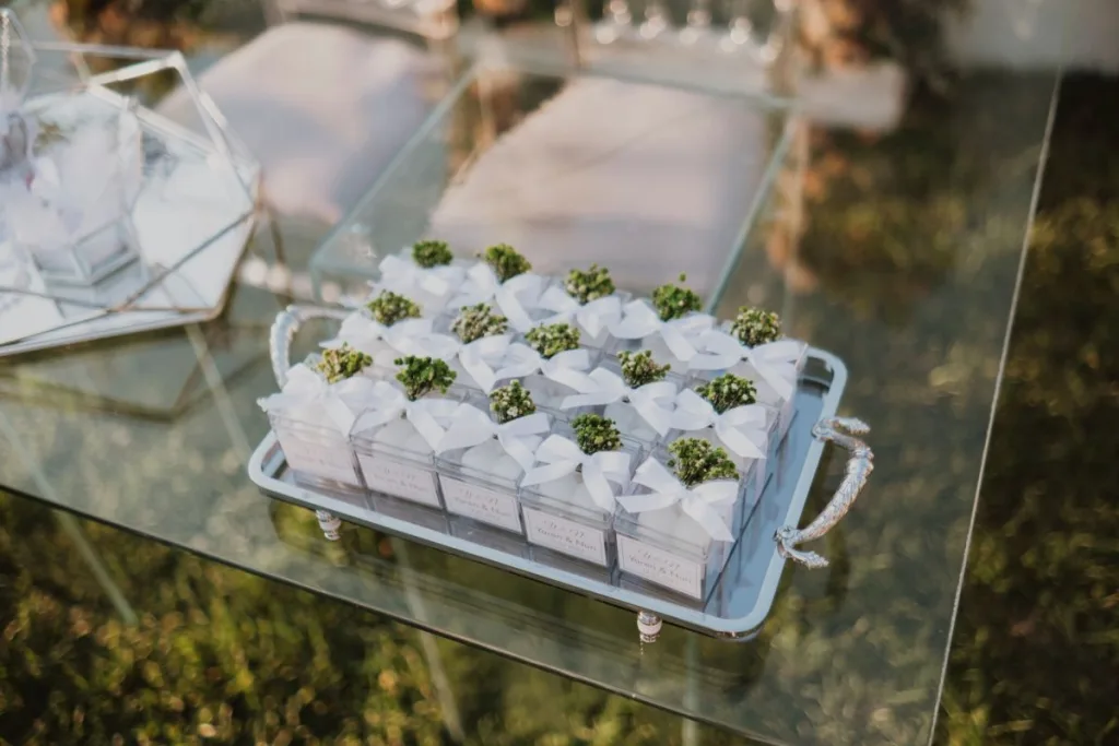 Wedding Gifts: 13 Personalised Ideas That Beat the Registry Personalised wedding favours arranged on a table, small enough for guests to take home