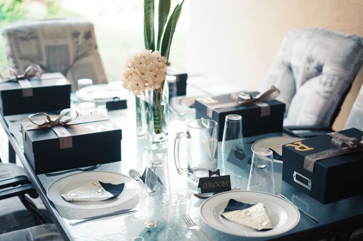 Wedding Gifts: 13 Personalised Ideas That Beat the Registry A wedding reception gift table with wrapped wedding gifts and florals